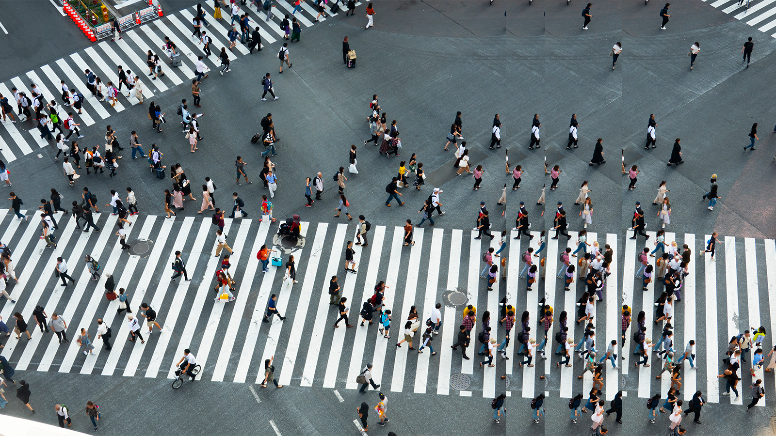 People walking over two crossings