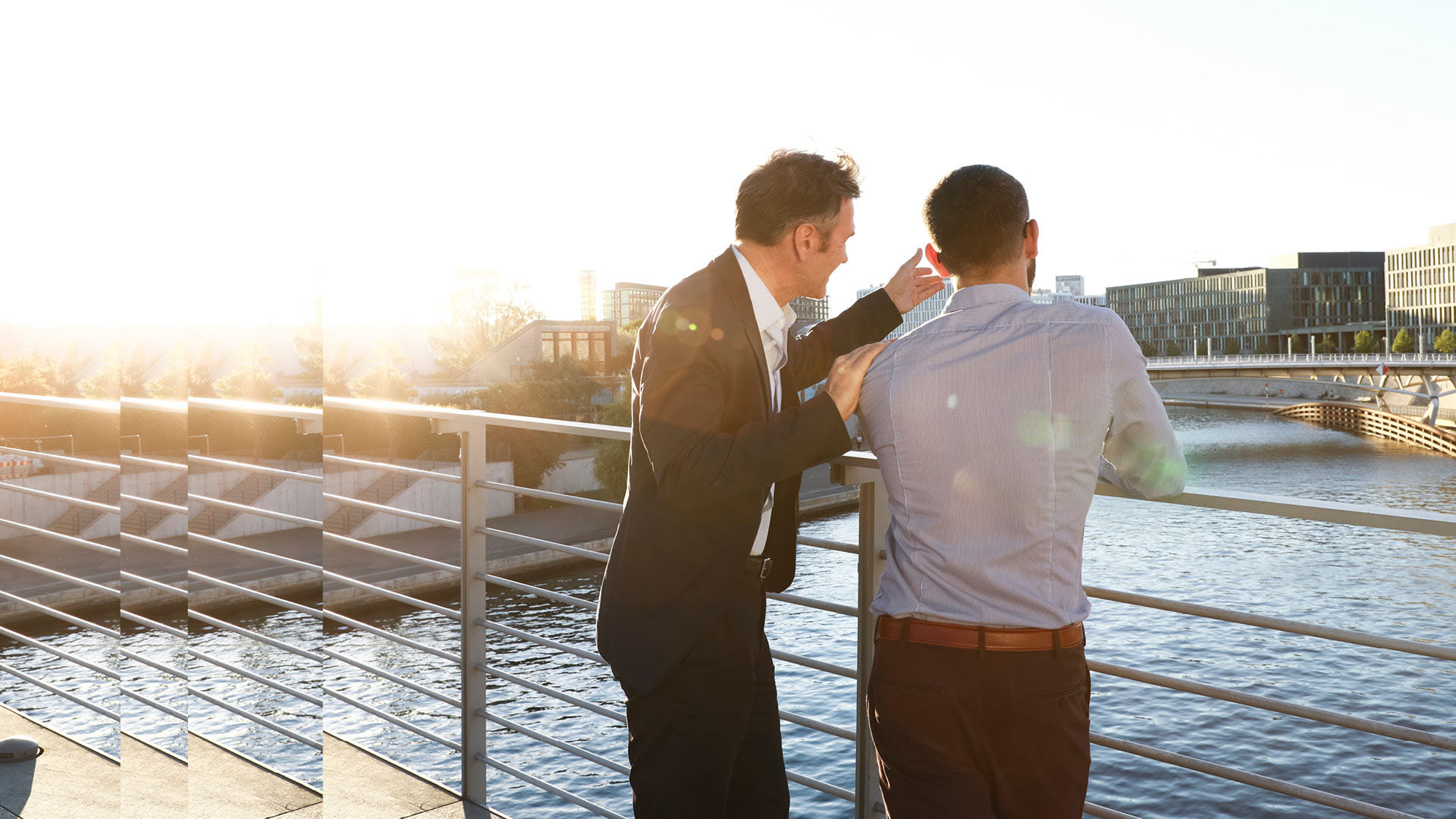 Two businessmen on a bridge family offices and private clients