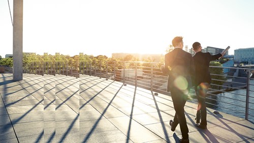 two businessmen walking