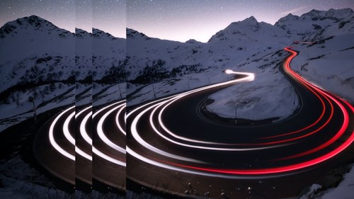 Car trails light road