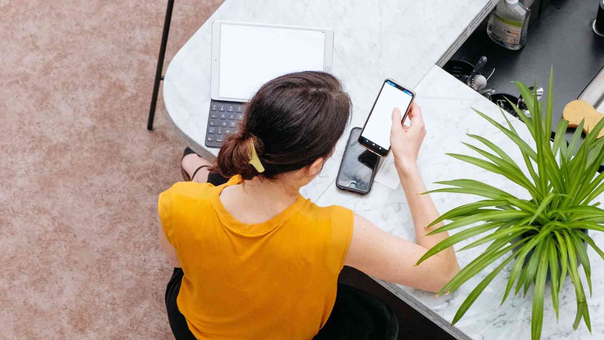 co-working woman yellow shirt