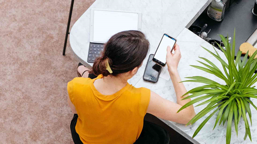 co-working woman yellow shirt