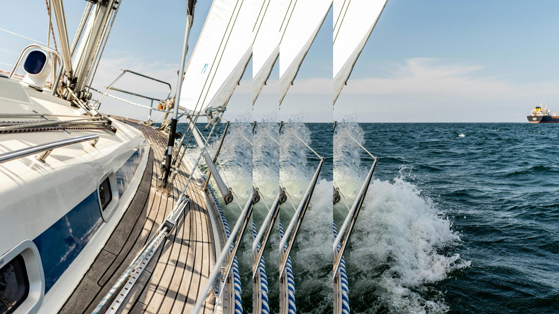 Sailboat and container ship