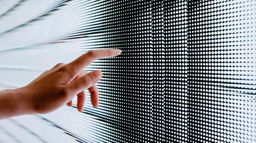 hand touching led wall screen