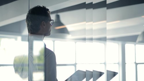 man with tablet in office
