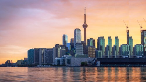Toronto skyline under glowing sunset pulsed