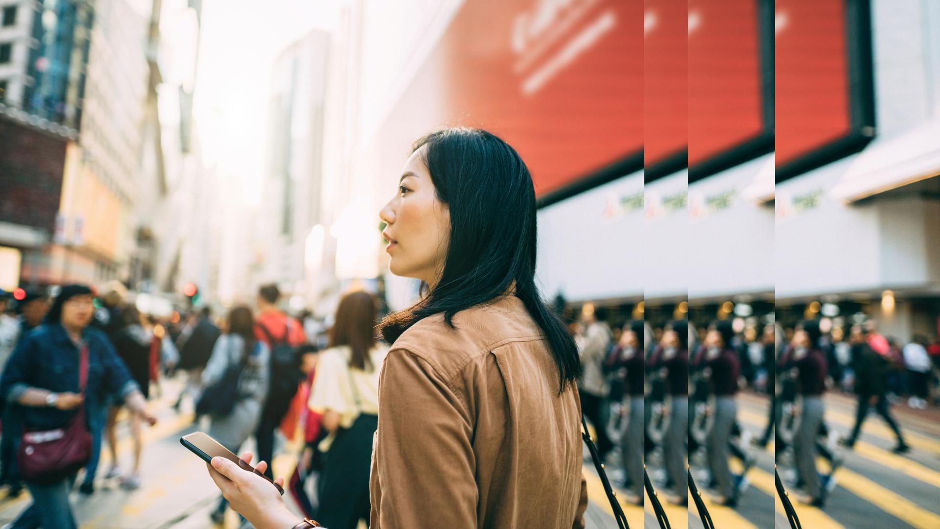 Woman mobile phone crossing