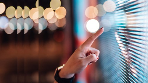 Hand touching digital display with pulse