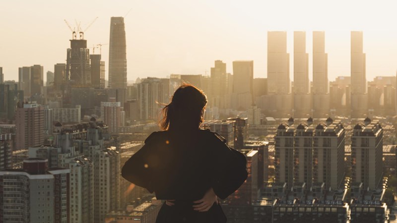 woman looking at city with pulse