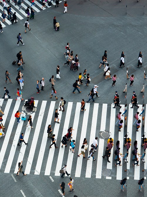 People walking over two crossings