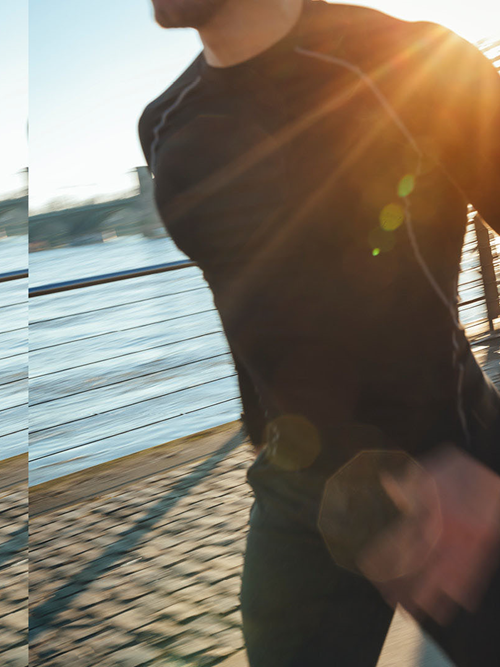 Man running at riverside transformation